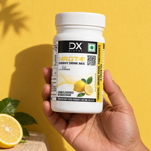 NRGT Lemon jar held against a warm yellow background
