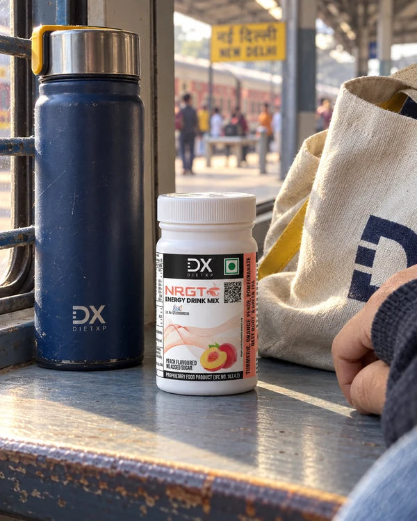 A small NRGT Peach jar and travel mug beside a bag