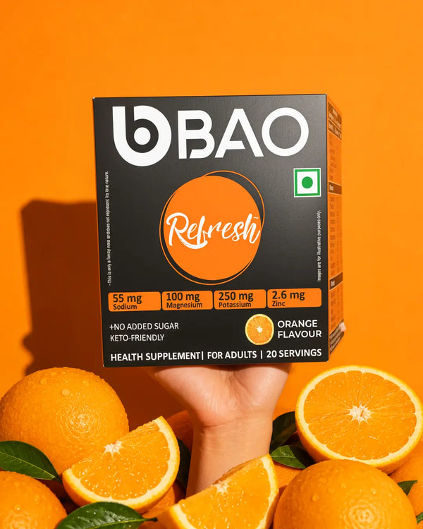 BAO Refresh pack held beside fresh oranges